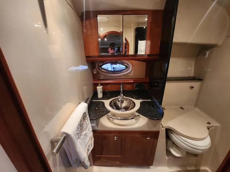 Slide: The Image of 2007 Four Winns 358 Vista yacht bathroom with modern fixtures and wood cabinetry. - 26