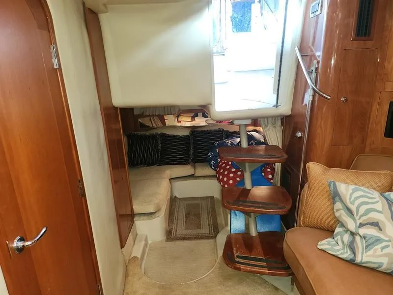 Slide: The Image of Interior of 2007 Four Winns 358 Vista yacht with wooden stairs and cozy seating area. - 27