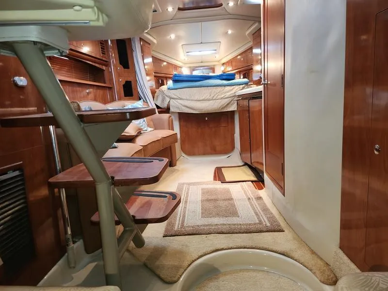 Slide: The Image of Interior of 2007 Four Winns 358 Vista yacht with wooden cabinetry and cozy seating. - 30