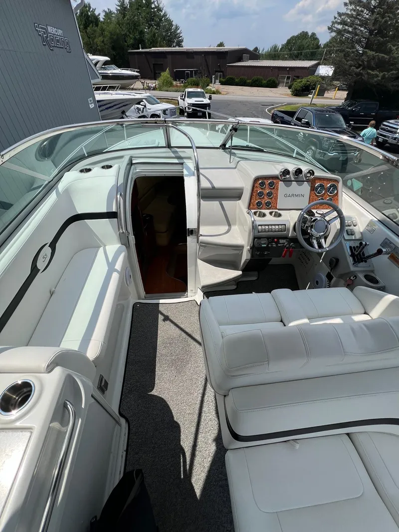 Slide: The Image of 2007 Formula 310SS boat interior with white seating and control panel. - 10