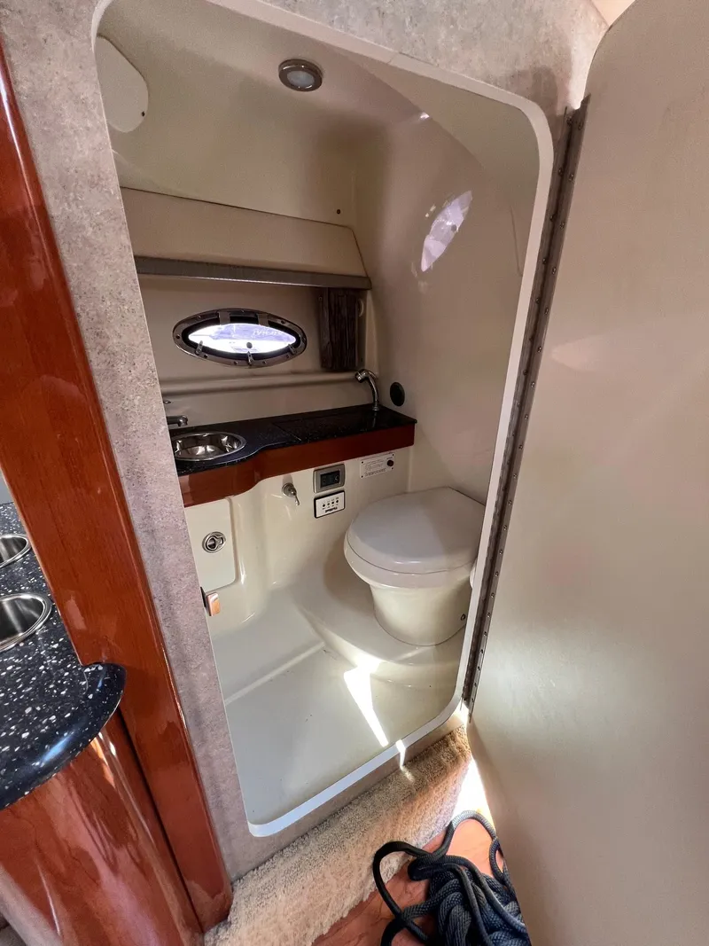 Slide: The Image of 2007 Formula 310SS boat interior bathroom with sink and toilet. - 11