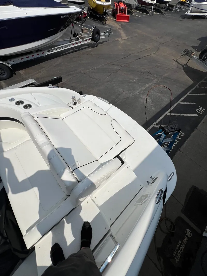 Slide: The Image of 2007 Formula 310SS boat in a marina, top view of the deck and seating area. - 13
