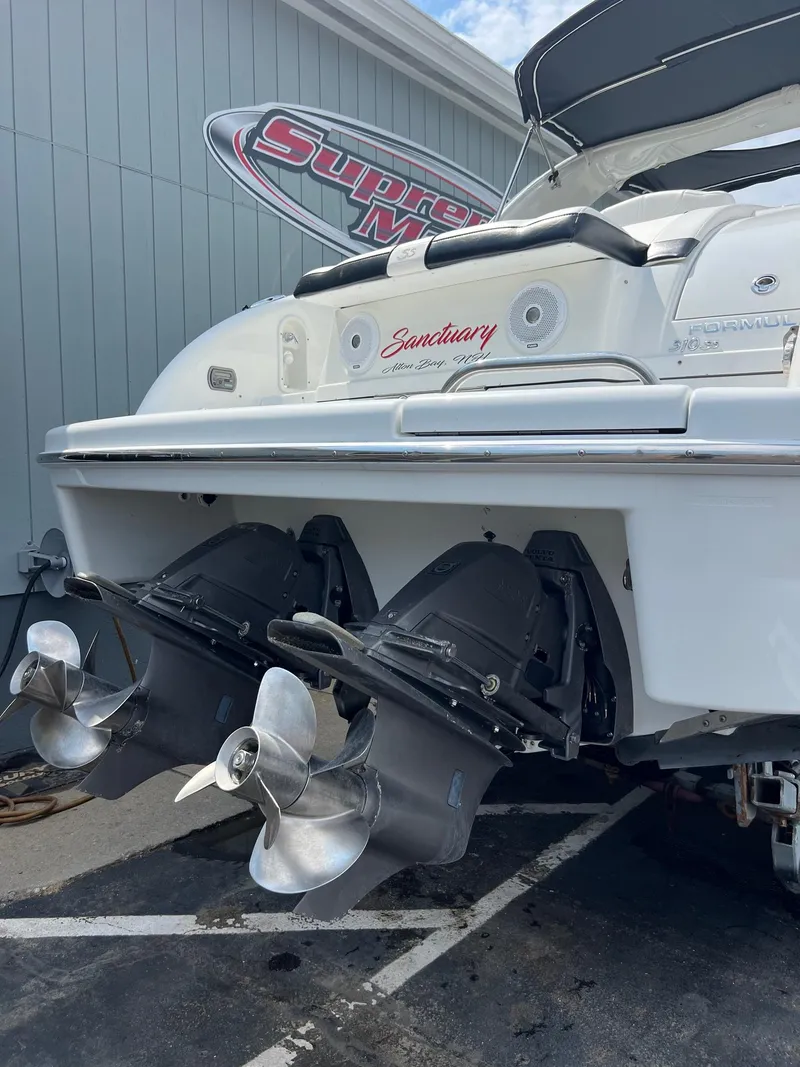 Slide: The Image of 2007 Formula 310SS boat stern with dual propellers at dock. - 15