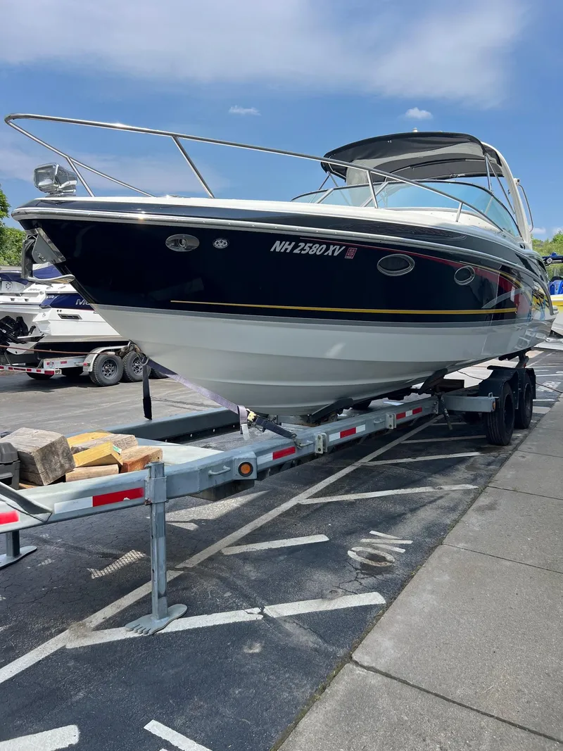 Slide: The Image of 2007 Formula 310SS boat on a trailer in a parking lot. - 19