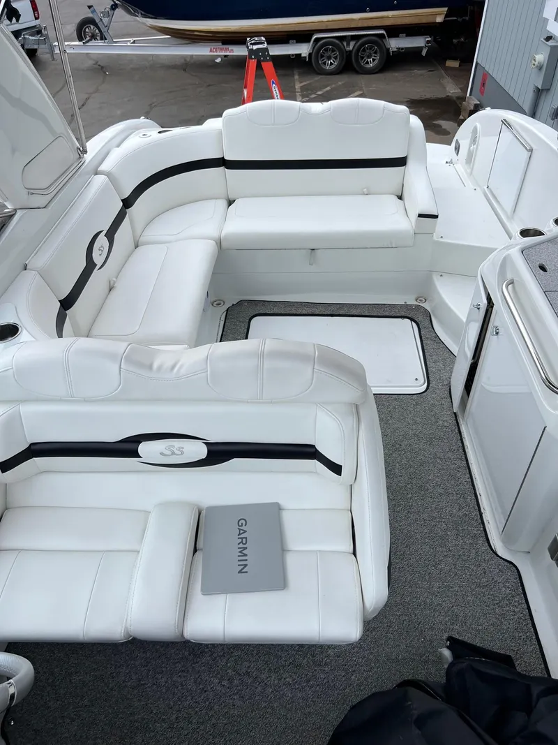 Slide: The Image of 2007 Formula 310SS boat interior with white seating and Garmin equipment. - 5