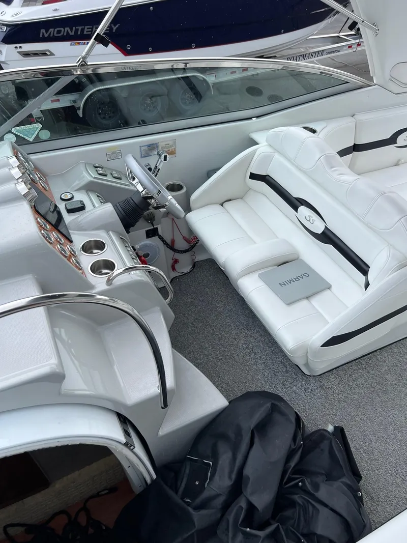Slide: The Image of 2007 Formula 310SS boat interior with white seating and control panel. - 7