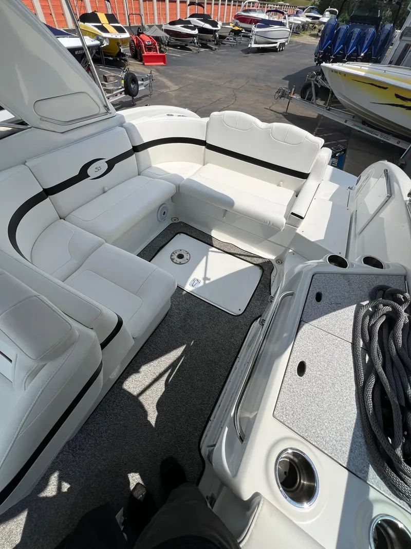 Slide: The Image of 2007 Formula 310SS boat interior with white seating and storage compartments. - 9
