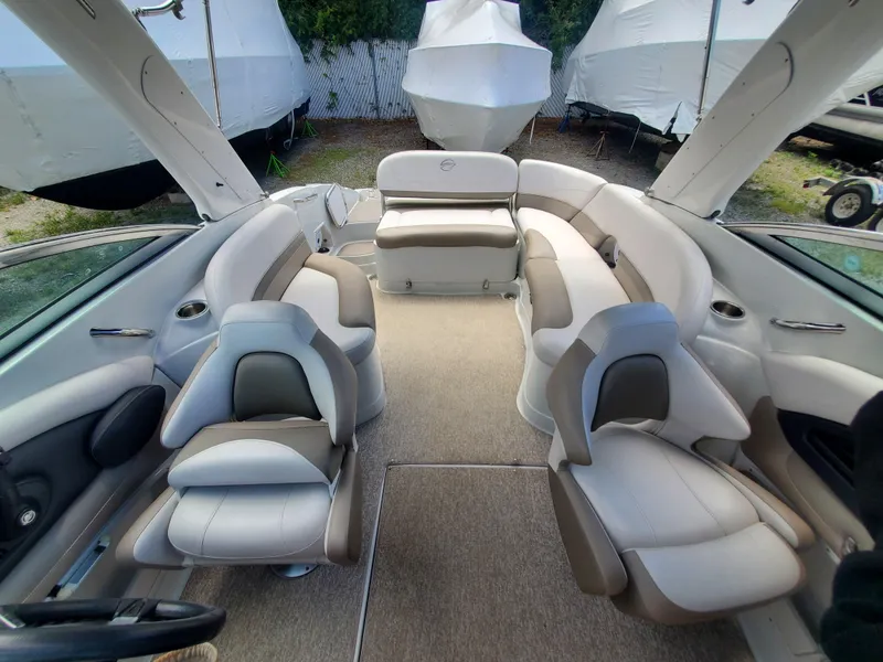 Slide: The Image of 2014 Crownline 285 SS boat interior with spacious seating and modern design. - 19