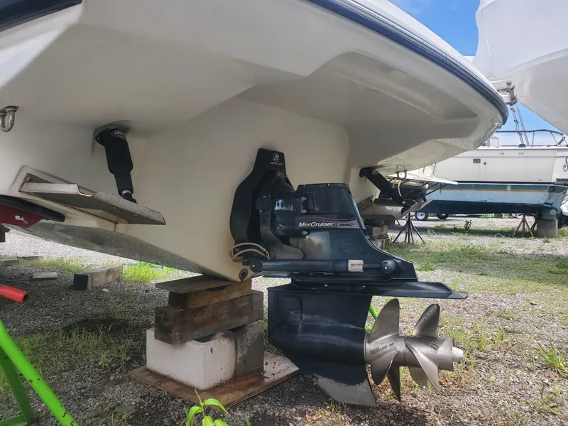 Slide: The Image of 2014 Crownline 285 SS boat stern with MerCruiser outdrive on blocks. - 3