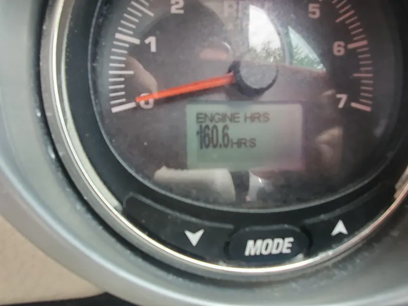 Slide: The Image of Close-up of 2014 Crownline 285 SS engine hour meter displaying 160.6 hours. - 4