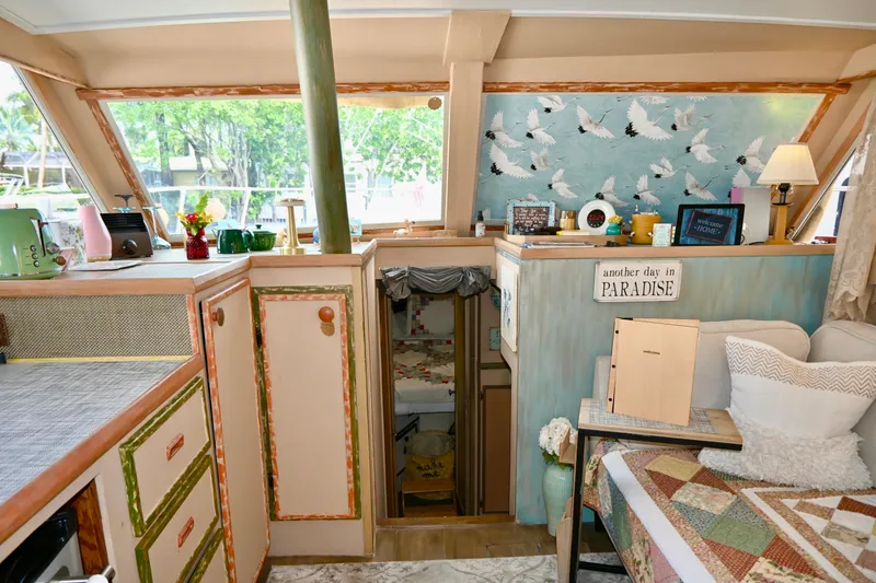 Slide: The Image of 1979 Uniflite Double Cabin interior with cozy decor and nautical theme. - 10