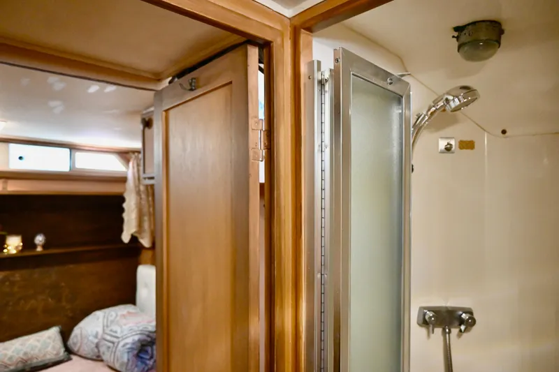 Slide: The Image of 1979 Uniflite Double Cabin interior with shower and cozy sleeping area. - 17