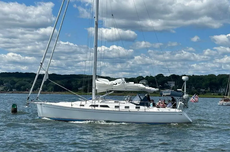 The Image of Saga 43 sailboat from 2001 cruising on a sunny day with scenic background. - 1