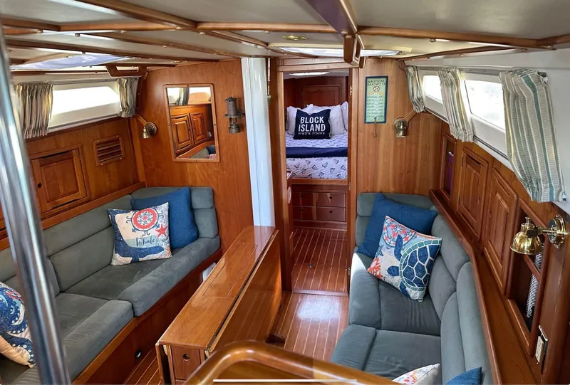 Slide: The Image of Interior of 2001 Saga 43 sailboat with cozy seating and nautical decor. - 5