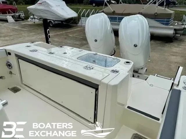 Slide: The Image of 2025 Cobia 265 Center Console with dual outboard engines. - 3