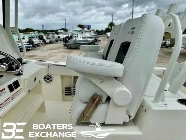 Slide: The Image of 2025 Cobia 265 Center Console boat with white seating. - 5