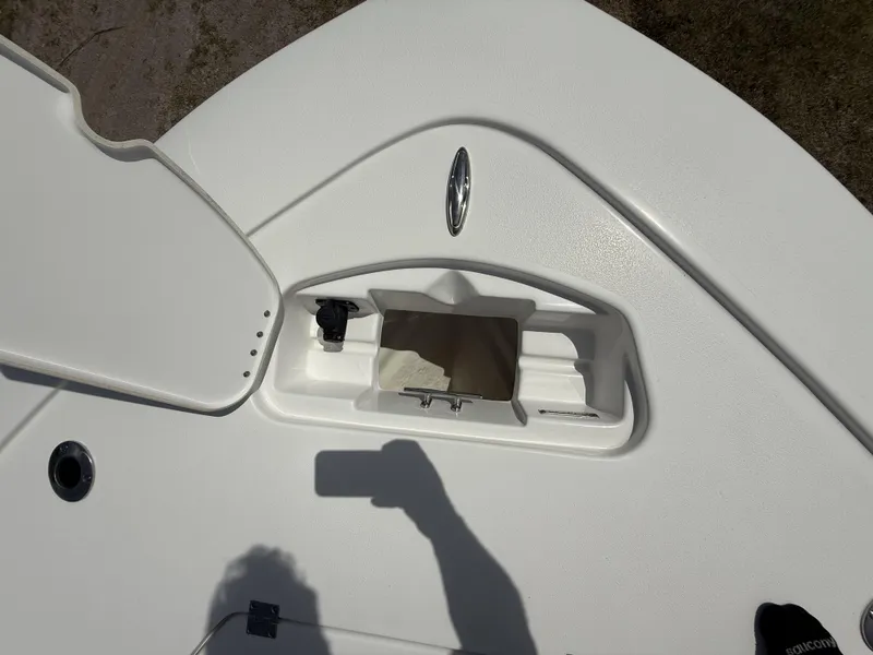 Slide: The Image of 2024 Tidewater 2410 Bay Max boat deck with open storage compartment. - 28