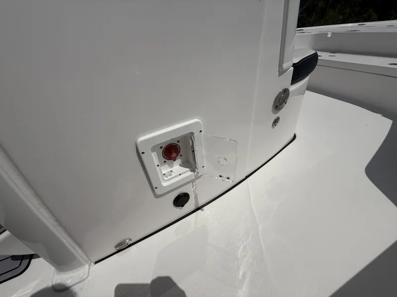 Slide: The Image of 2024 Tidewater 2410 Bay Max boat detail, featuring a white deck and control panel. - 41
