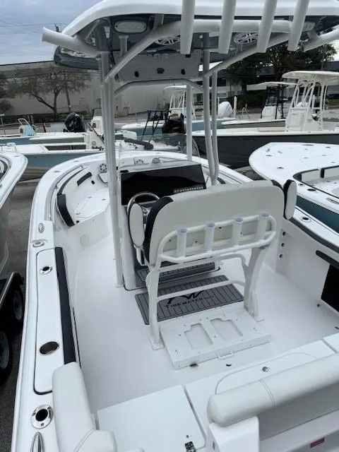 Slide: The Image of 2024 Tidewater 220 LXF boat interior with center console and seating. - 13