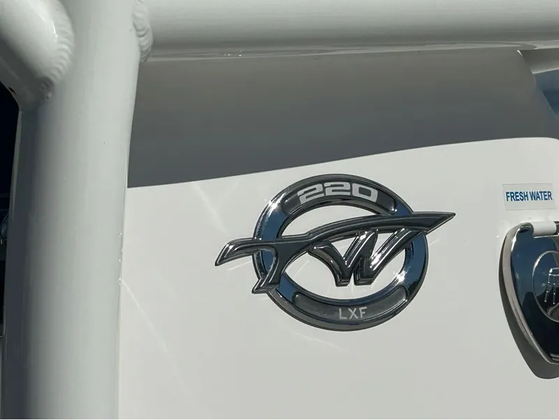 Slide: The Image of Close-up of 2024 Tidewater 220 LXF boat logo and fresh water label. - 16