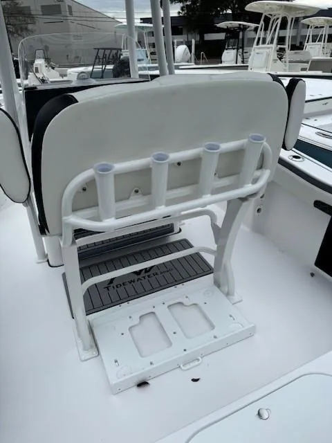 Slide: The Image of 2024 Tidewater 220 LXF boat interior with rod holders and seating. - 19