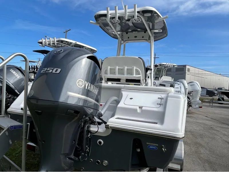 Slide: The Image of 2024 Tidewater 220 LXF boat with Yamaha 250 engine, parked outdoors. - 23