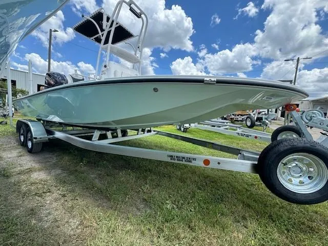 Slide: The Image of 2024 Tidewater 23 TPC RAPTOR boat on trailer under blue sky. - 11