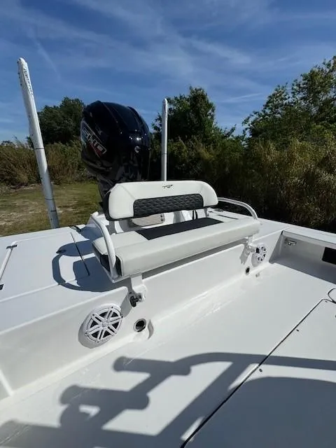 Slide: The Image of 2024 Tidewater 23 TPC RAPTOR boat with seating and outboard motor. - 14