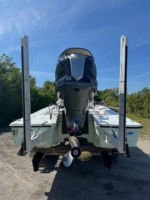 Slide: The Image of 2024 Tidewater 23 TPC RAPTOR boat rear view with outboard motor. - 16