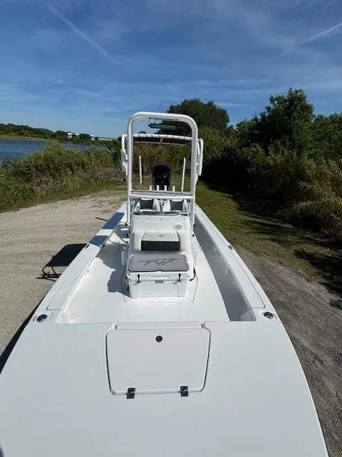 Slide: The Image of 2024 Tidewater 23 TPC RAPTOR boat on a sunny day near a lake. - 3