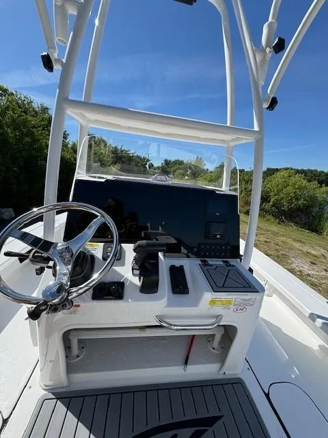 Slide: The Image of 2024 Tidewater 23 TPC RAPTOR boat console with steering wheel and navigation equipment. - 5