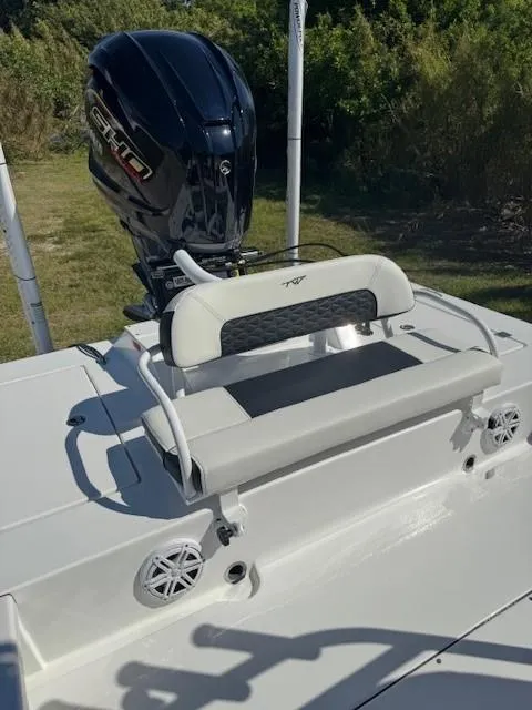 Slide: The Image of 2024 Tidewater 23 TPC RAPTOR boat with motor and seating. - 7