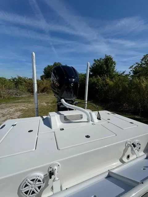 Slide: The Image of 2024 Tidewater 23 TPC RAPTOR boat with outboard motor in scenic outdoor setting. - 8