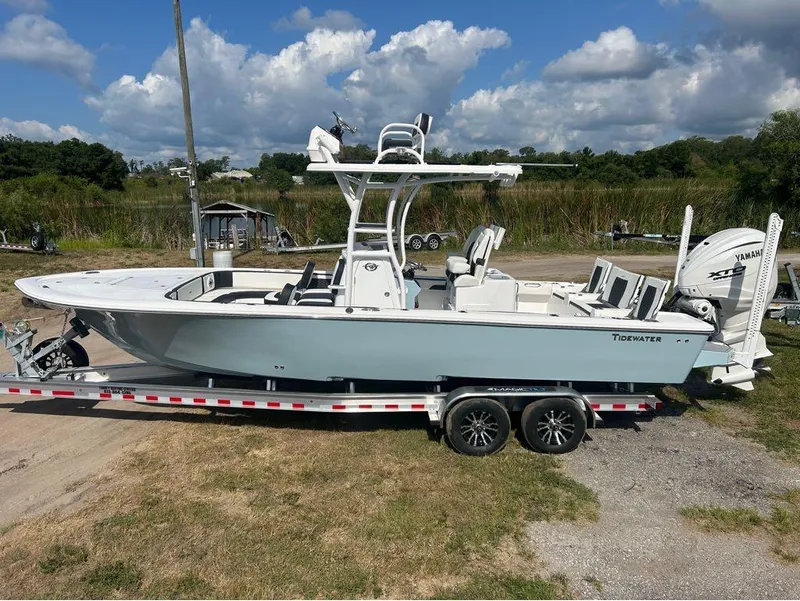Slide: The Image of 2025 Tidewater 2700 Carolina Bay boat on a trailer with Yamaha engine. - 1