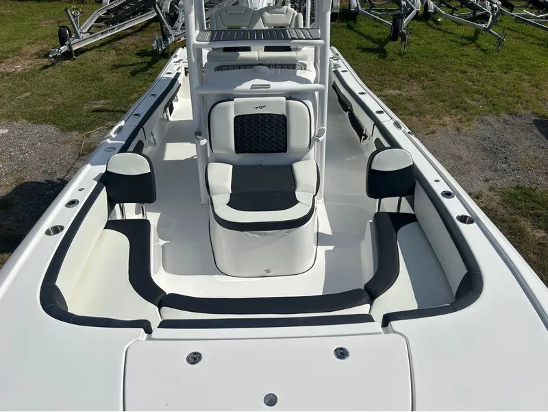 Slide: The Image of 2025 Tidewater 2700 Carolina Bay boat interior with seating and console. - 11