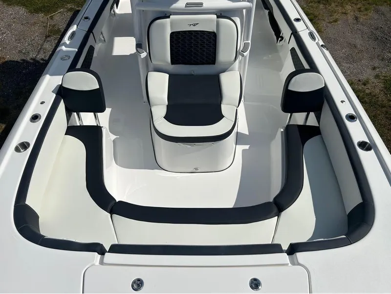 Slide: The Image of 2025 Tidewater 2700 Carolina Bay boat interior with cushioned seating. - 14