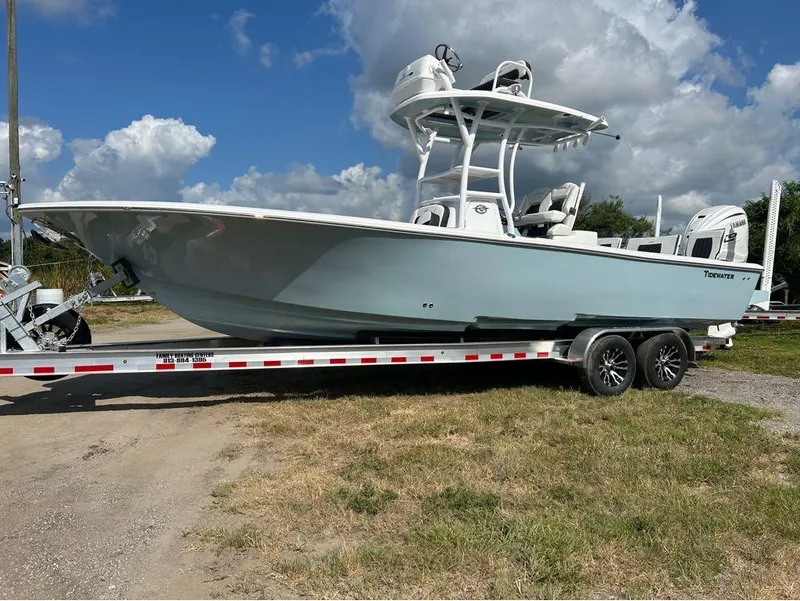 Slide: The Image of 2025 Tidewater 2700 Carolina Bay boat on a trailer under a blue sky. - 15