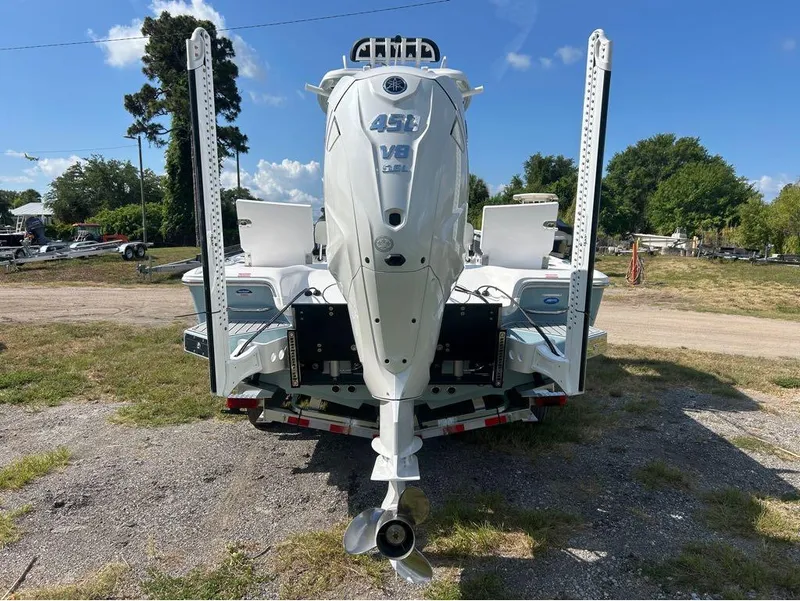 Slide: The Image of 2025 Tidewater 2700 Carolina Bay boat with a powerful V8 engine, rear view. - 25