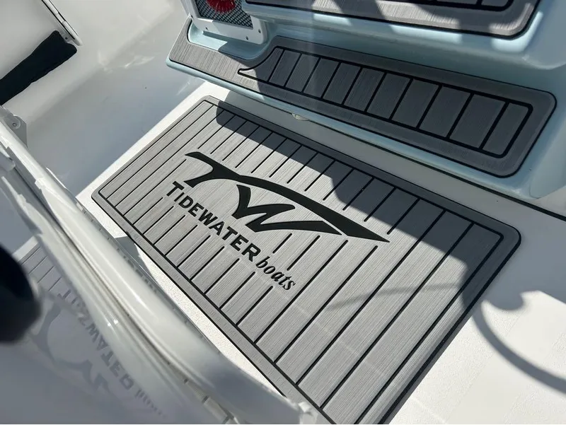 Slide: The Image of Tidewater 2700 Carolina Bay 2025 boat interior with branded floor mat. - 26