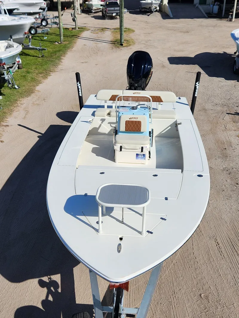 Slide: The Image of 2024 Hewes 21 REDFISHER boat on trailer, top view, in a boatyard. - 3