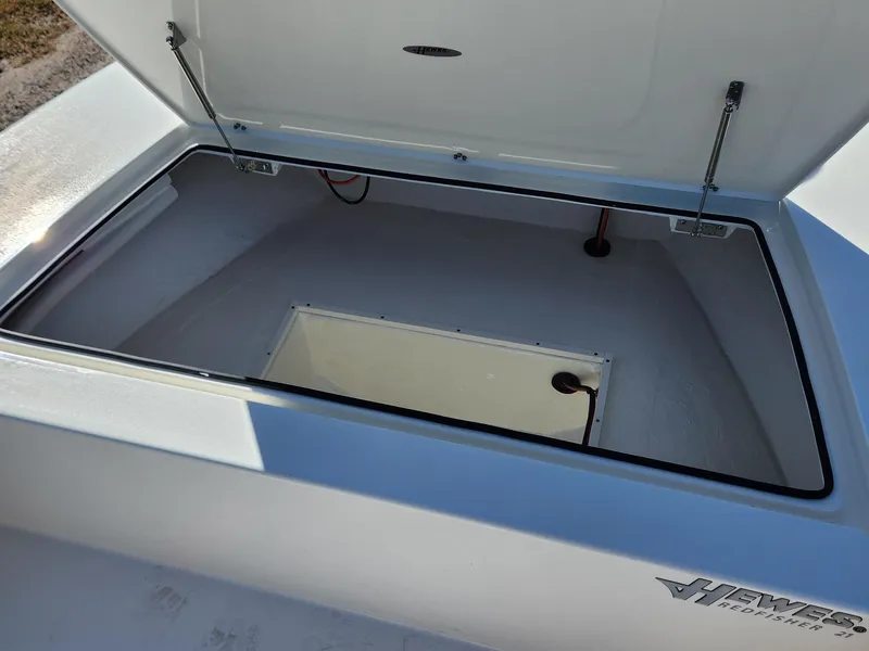 Slide: The Image of Open storage compartment of 2024 Hewes 21 REDFISHER boat. - 7