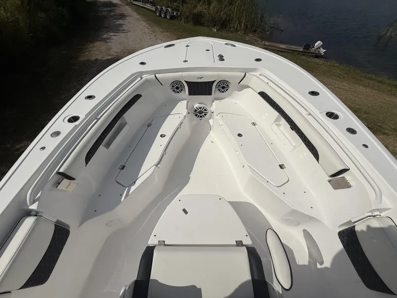 Slide: The Image of 2024 Tidewater 256 LXF boat interior with seating and storage compartments. - 35
