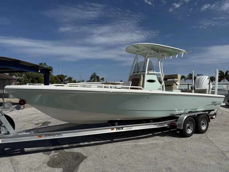 Slide: The Image of 2024 Pathfinder 2600 TRS boat on trailer under clear blue sky. - 1