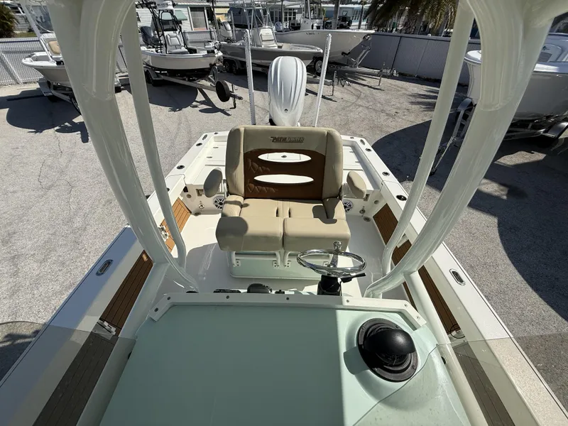 Slide: The Image of 2024 Pathfinder 2600 TRS boat interior with helm and seating area. - 15