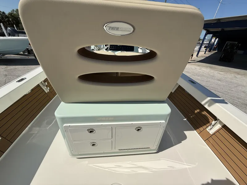 Slide: The Image of 2024 Pathfinder 2600 TRS boat interior with storage compartments and cushioned seating. - 17