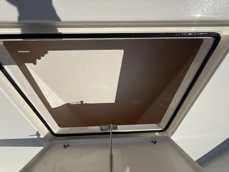 Slide: The Image of Open hatch on 2024 Pathfinder 2600 TRS boat, showing interior details. - 21
