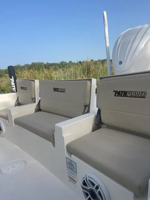 Slide: The Image of 2024 Pathfinder 2600 TRS boat seats with logo, outdoor setting. - 27