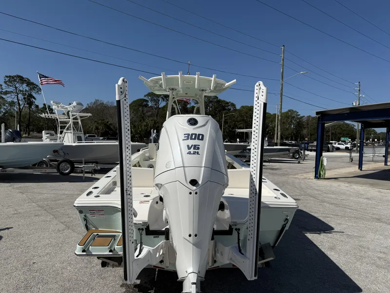 Slide: The Image of 2024 Pathfinder 2600 TRS boat with 300 V6 engine, displayed outdoors. - 32