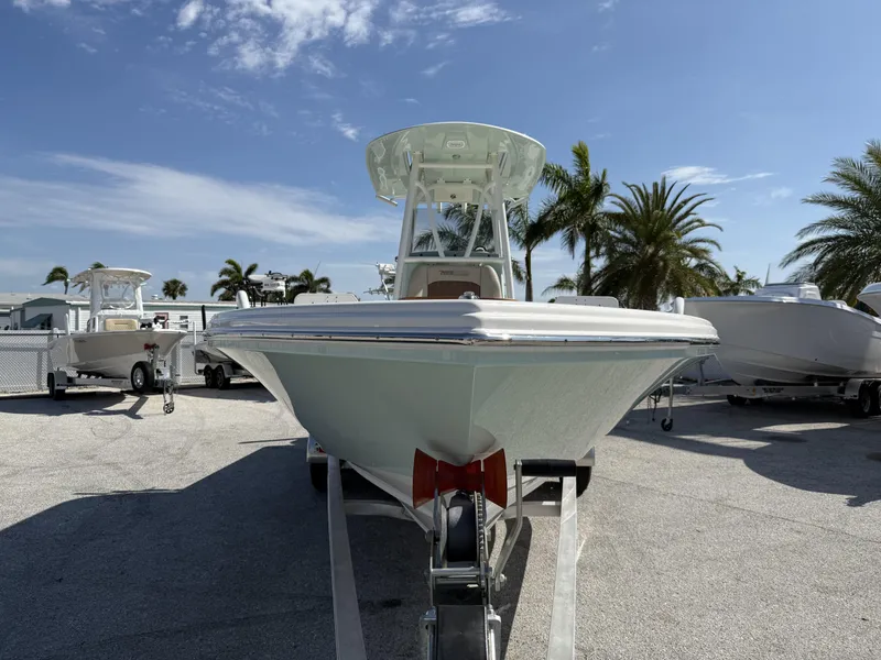 Slide: The Image of 2024 Pathfinder 2600 TRS boat on trailer, sunny day, palm trees in background. - 35