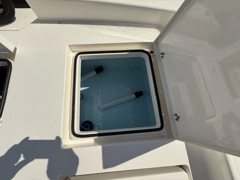 Slide: The Image of Open storage compartment on 2024 Pathfinder 2600 TRS boat, showing interior details. - 45